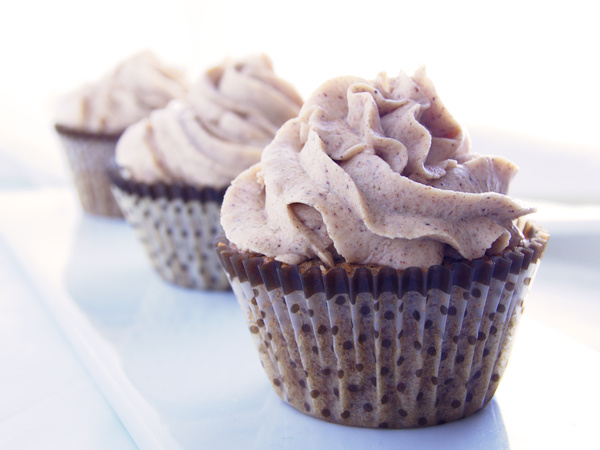 cinnamon cupcakes topped with a cinnamon cream cheese frosting